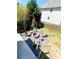 Backyard fire pit area with Adirondack chairs and pea gravel at 2671 Moon Chase Ln, Buford, GA 30519