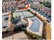 Community aerial shot featuring tennis courts, a pool, clubhouse, and surrounding homes, highlighting the neighborhood amenities at 3315 Sardis Bend Dr, Buford, GA 30519