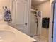 This bathroom has a glass enclosed shower and white vanity, creating a bright, spa-like atmosphere at 3315 Sardis Bend Dr, Buford, GA 30519