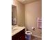 Bathroom with a single sink vanity, toilet, and shower, creating a functional space at 3315 Sardis Bend Dr, Buford, GA 30519
