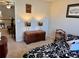 Bedroom with black and white comforter set and side door access to the other rooms at 3315 Sardis Bend Dr, Buford, GA 30519