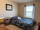 Cozy bedroom with a window providing natural light and calming floral bedding, creating a relaxing space at 3315 Sardis Bend Dr, Buford, GA 30519