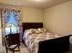 This bedroom has an accent chair and decorative blanket, creating a cozy space at 3315 Sardis Bend Dr, Buford, GA 30519