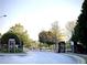 Gated community entrance with stone pillars and manicured landscaping, ensuring privacy and security for residents at 3315 Sardis Bend Dr, Buford, GA 30519