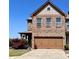 Charming brick two-story home with a two-car garage and well-maintained front yard at 3315 Sardis Bend Dr, Buford, GA 30519
