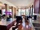 Bright open-concept living room with hardwood floors and large windows at 3315 Sardis Bend Dr, Buford, GA 30519