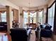 Living room with plush seating and large windows with decorative valances at 3315 Sardis Bend Dr, Buford, GA 30519