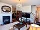 Cozy living room showcasing a fireplace, elegant decor, and hardwood floors at 3315 Sardis Bend Dr, Buford, GA 30519