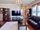Spacious living room with hardwood floors, comfortable furniture, and bright natural light at 3315 Sardis Bend Dr, Buford, GA 30519