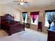 Spacious main bedroom boasts neutral colors and a ceiling fan, providing a relaxing retreat at 3315 Sardis Bend Dr, Buford, GA 30519