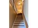 Staircase with wood railing and white risers leading to the upper level at 3315 Sardis Bend Dr, Buford, GA 30519