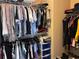 Well-organized walk-in closet with hanging rods, shelves, and drawers for optimal storage at 3315 Sardis Bend Dr, Buford, GA 30519