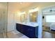 Bathroom with double sinks, granite counters, and access to glass-enclosed shower at 351 Senna St, Marietta, GA 30064