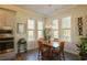 Sunlit dining area with a wooden table, four chairs, and large windows at 351 Senna St, Marietta, GA 30064