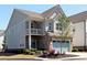 Charming two-story home with a light gray exterior, a balcony, a light blue front door and a two-car light blue garage at 351 Senna St, Marietta, GA 30064