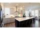 Modern kitchen with stainless steel appliances, a large island with seating, and gray cabinetry at 351 Senna St, Marietta, GA 30064