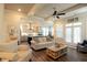Open-concept living room featuring hardwood floors, modern furniture, and view to kitchen with island and stainless appliances at 351 Senna St, Marietta, GA 30064