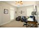 Bright office space with a ceiling fan, two chairs, and access to the outside at 351 Senna St, Marietta, GA 30064