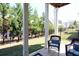Relaxing covered patio with wicker furniture overlooking the backyard and neighborhood at 351 Senna St, Marietta, GA 30064