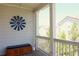 Inviting front porch features a charming windmill decoration and cushioned bench seating at 351 Senna St, Marietta, GA 30064