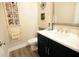 Stylish powder room with black vanity, white countertop, and decorative accents at 351 Senna St, Marietta, GA 30064