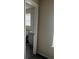 Bright bathroom featuring modern gray vanity, seen through doorway at 4071 River Rd, Ellenwood, GA 30294