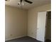 Cozy bedroom showcasing gray carpet, beige walls, ceiling fan and closet at 4071 River Rd, Ellenwood, GA 30294