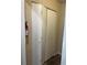 Utility closet with bi-fold doors; adjacent to a fire extinguisher at 4071 River Rd, Ellenwood, GA 30294