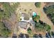 Expansive aerial view of the property showcasing the pool, home, and surrounding landscape at 813 Sandy Creek Rd, Fayetteville, GA 30214