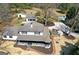 Aerial view of a home with a pool, detached garage, and mature trees on a large lot at 813 Sandy Creek Rd, Fayetteville, GA 30214