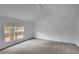 Spacious bedroom offers neutral carpet and ample light from its double windows at 813 Sandy Creek Rd, Fayetteville, GA 30214