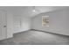 Carpeted bedroom with neutral paint, vaulted ceiling, and fan with window view at 813 Sandy Creek Rd, Fayetteville, GA 30214