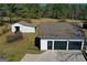 Three-car detached garage with additional outbuilding on an expansive property at 813 Sandy Creek Rd, Fayetteville, GA 30214