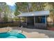 Inviting pool area with a shaded pavilion, perfect for relaxation and entertaining at 813 Sandy Creek Rd, Fayetteville, GA 30214