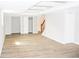 Spacious finished basement with vinyl floors, access to stairs and closet at 1584 Hebron Ln, Riverdale, GA 30296