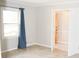 Cozy bedroom with a large window and neutral paint at 1584 Hebron Ln, Riverdale, GA 30296