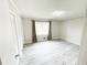 This bedroom offers spacious layout, new vinyl flooring, and a window with natural light at 1584 Hebron Ln, Riverdale, GA 30296