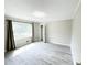 Bright bedroom featuring wood-look flooring and closet at 1584 Hebron Ln, Riverdale, GA 30296