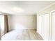 Bright bedroom with new gray floors, neutral walls and trim, and double door closet at 1584 Hebron Ln, Riverdale, GA 30296