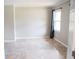 Bright bedroom featuring neutral walls, decorative flooring, and a window with stylish curtain at 1584 Hebron Ln, Riverdale, GA 30296