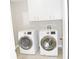 Laundry room equipped with modern washer and dryer at 1584 Hebron Ln, Riverdale, GA 30296