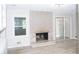 Bright living room with brick fireplace and updated flooring at 1584 Hebron Ln, Riverdale, GA 30296