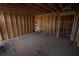 A view of an unfinished room with exposed wooden studs and subflooring, ready for transformation at 2055 Marco Dr, Decatur, GA 30032