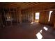 A view of an unfinished room with exposed wood beams and studs, offering customization options at 2055 Marco Dr, Decatur, GA 30032