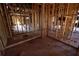 A view of an unfinished room with wood beams and studs, highlighting the potential for customization at 2055 Marco Dr, Decatur, GA 30032