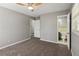 Bedroom with carpet, neutral walls, ceiling fan, and view into the bathroom at 4442 Mark Anthony Ct, Decatur, GA 30035