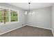 Neutral dining room with natural light and modern light fixture at 4442 Mark Anthony Ct, Decatur, GA 30035