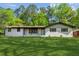 Charming white brick home with a lush green lawn and inviting front porch at 4442 Mark Anthony Ct, Decatur, GA 30035