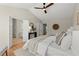 This bright bedroom with vaulted ceiling features wood floors and access to an ensuite bathroom at 5755 Haterleigh Dr, Alpharetta, GA 30005