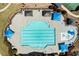 Aerial view of community pool with umbrellas, splash pad, lounge chairs and landscaped surroundings at 5755 Haterleigh Dr, Alpharetta, GA 30005